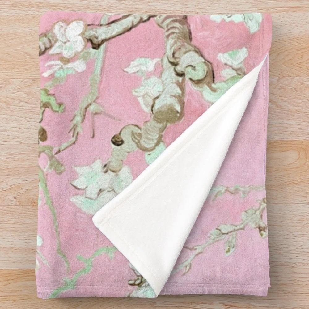 Pale pink plush blanket with floral design inspired by van Gogh's Almond Blossoms