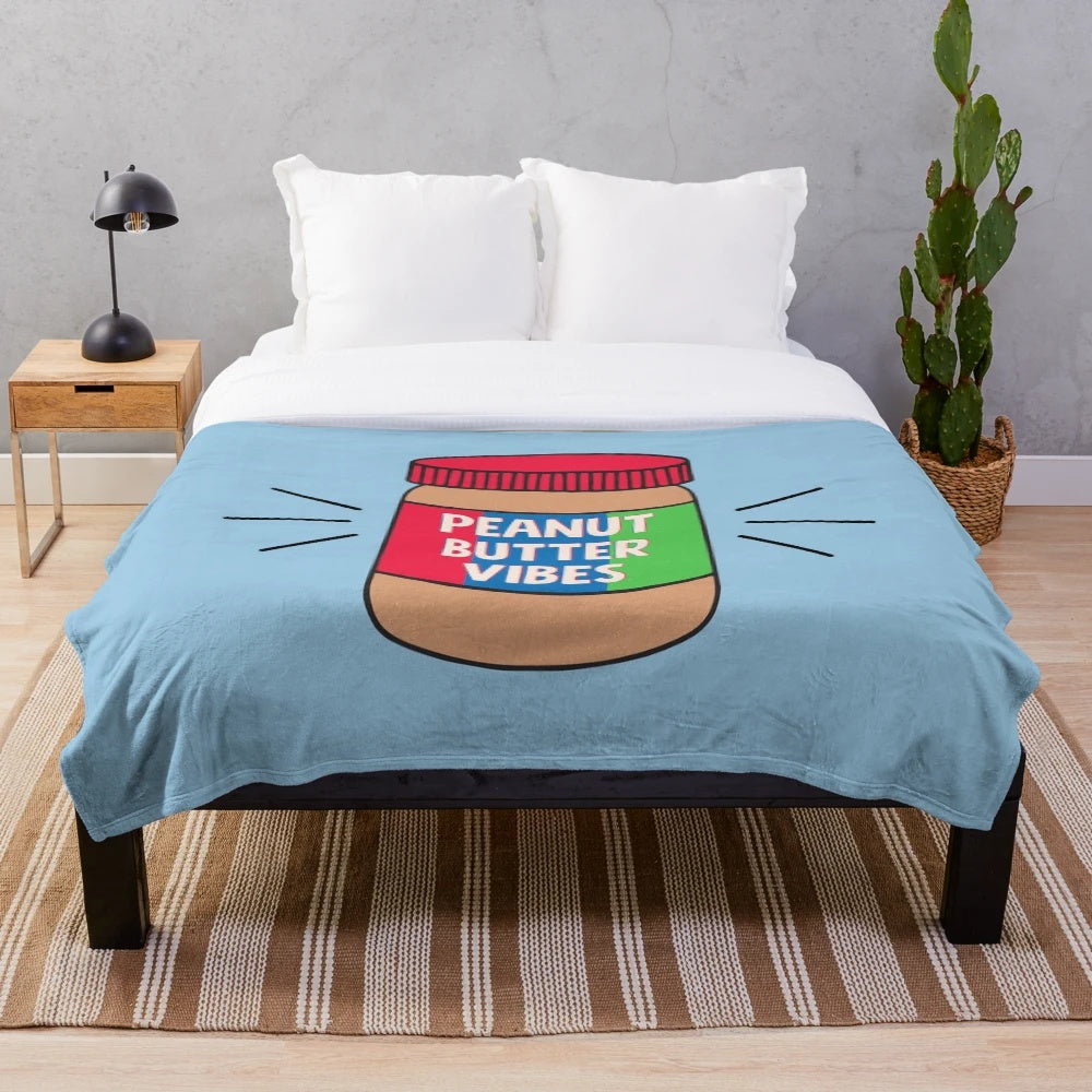 Peanut butter colored plush blanket with a cozy, soft texture