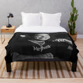 Soft and cozy Phora plush blanket with "Love is Hell" design