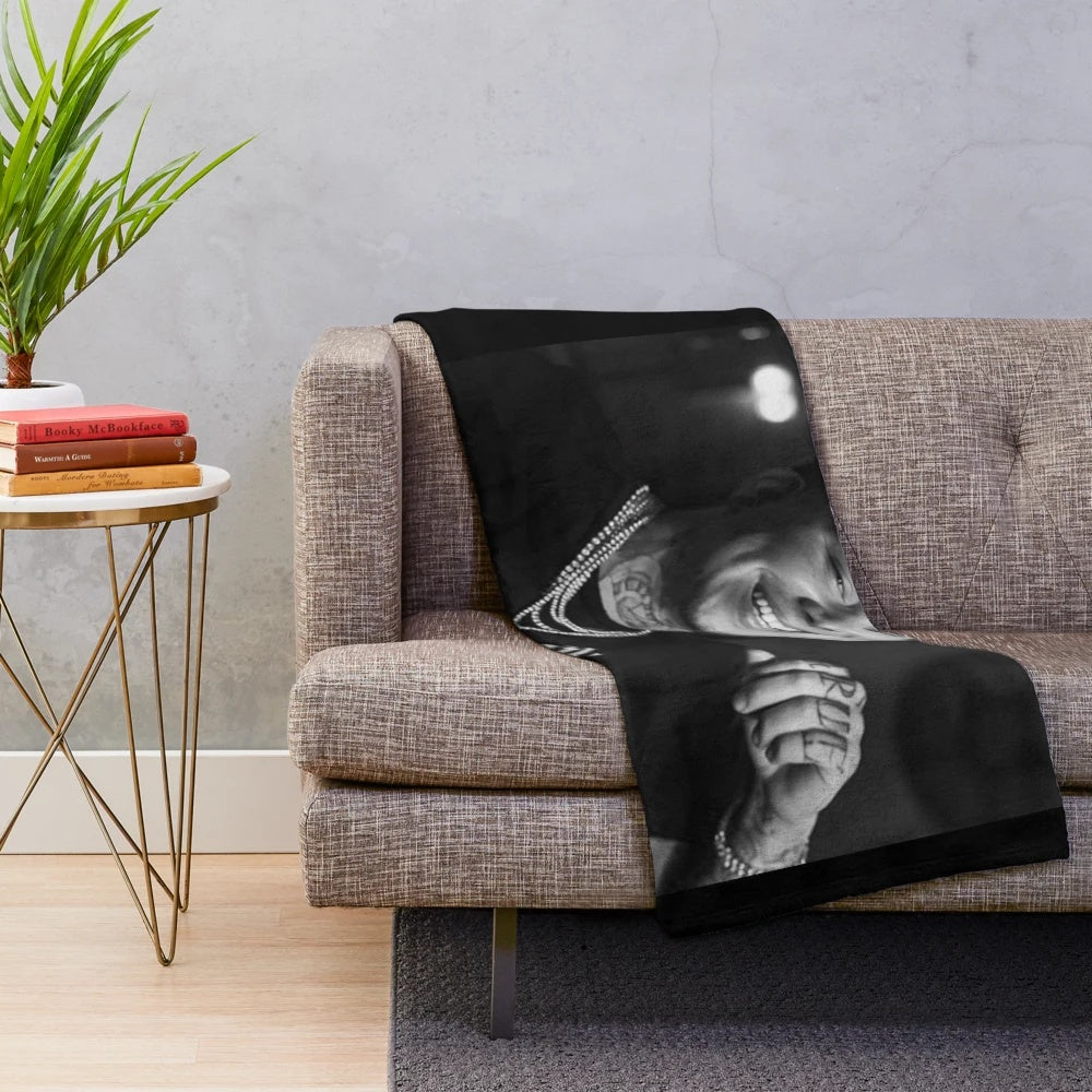 Soft and cozy Phora plush blanket with "Love is Hell" design