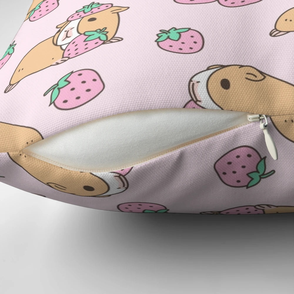 Plush pink pillow with a whimsical guinea pig and strawberry pattern, perfect for adding a touch of cute to any room.