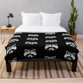 Soft and plush raccoon face design blanket