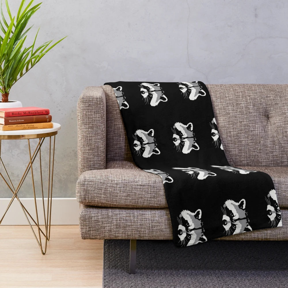 Soft and plush raccoon face design blanket