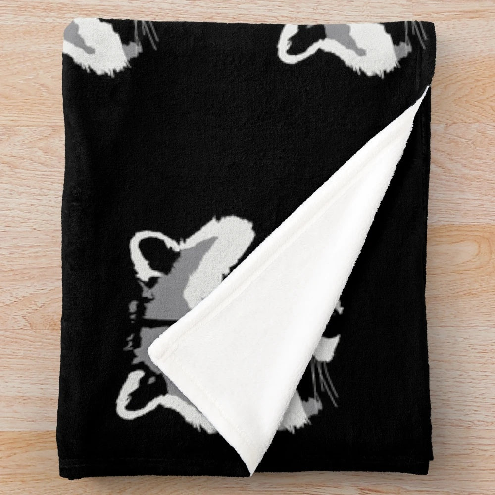 Soft and plush raccoon face design blanket