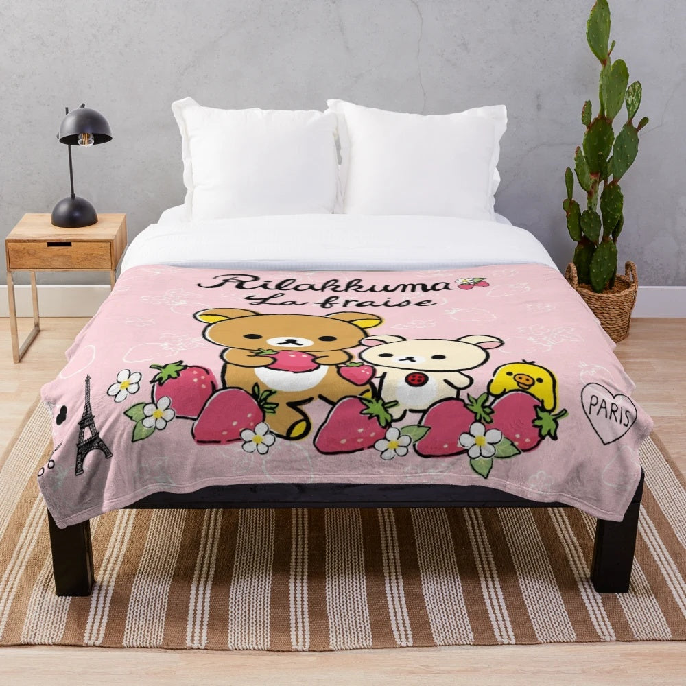 Rilakkuma-inspired plush blanket with a cute strawberry design