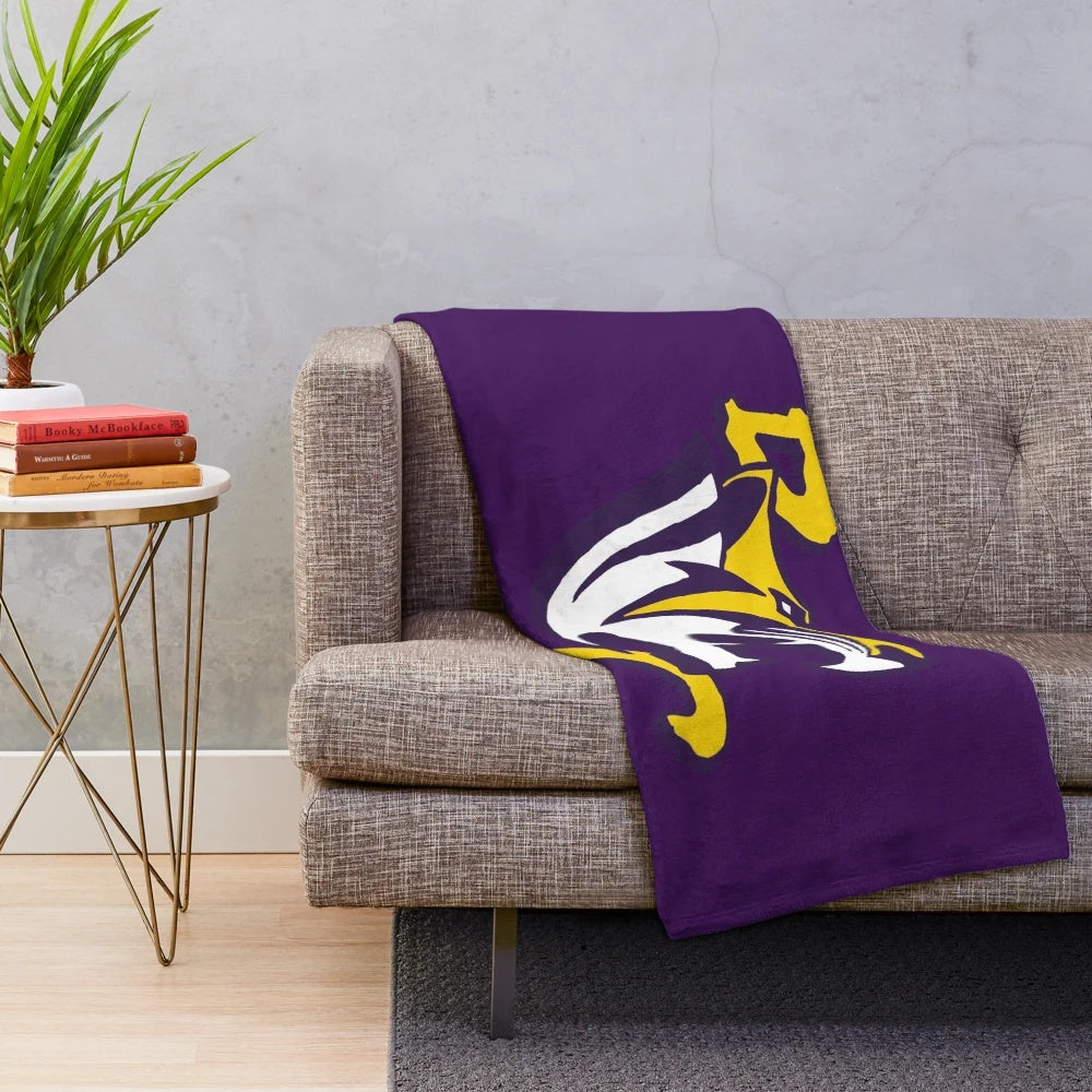 A soft and plush blanket featuring the Benedict Tigers mascot and school colors