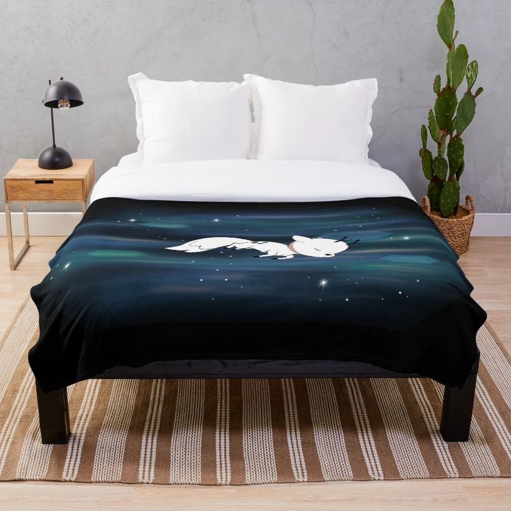 Twig plush blanket with a deer fox and night sky design