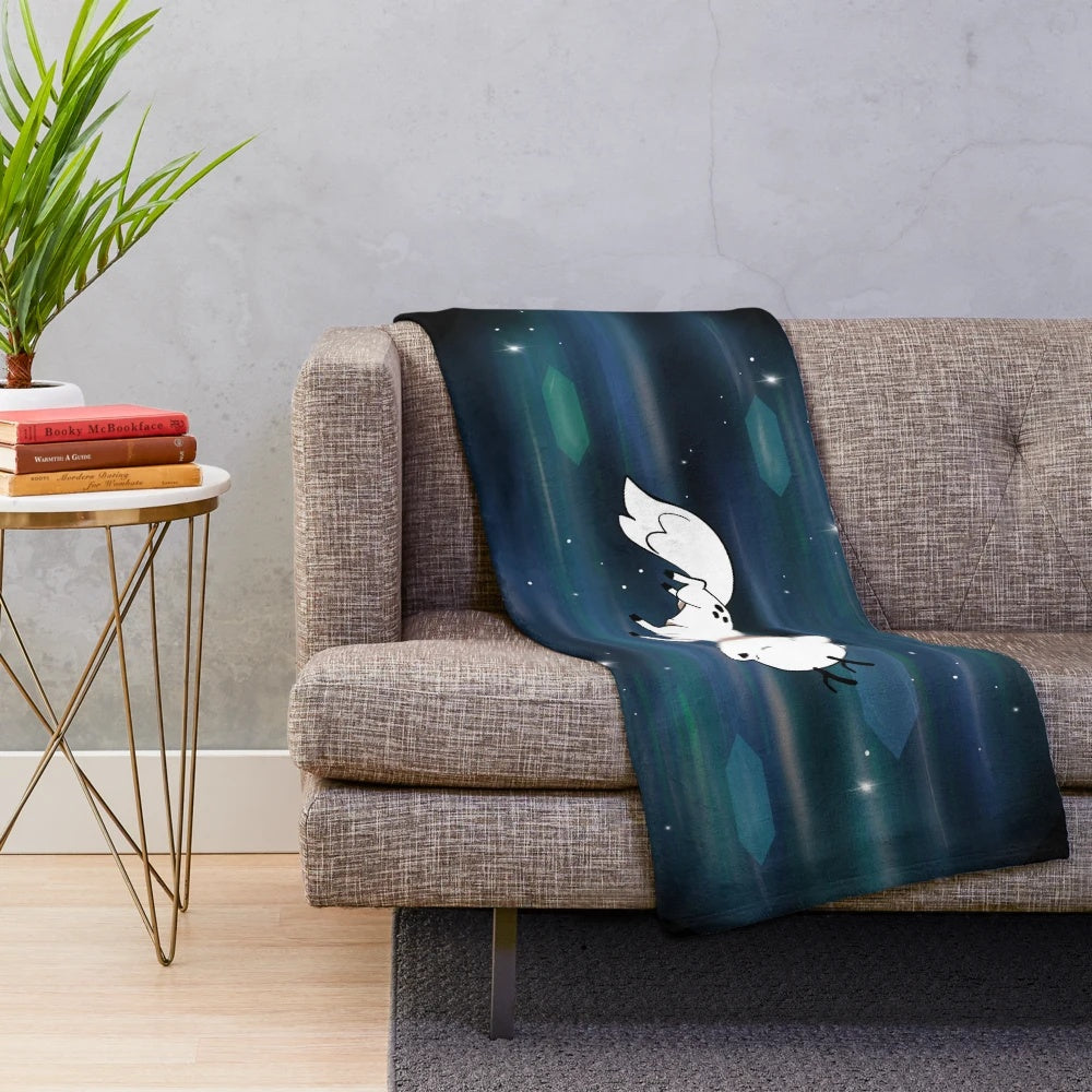 Twig plush blanket with a deer fox and night sky design
