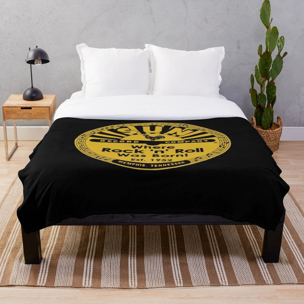 Soft and cozy plush blanket featuring the iconic Sun Records logo, perfect for music lovers.