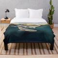 Soft and cozy plush blanket with a whale and ocean-inspired design
