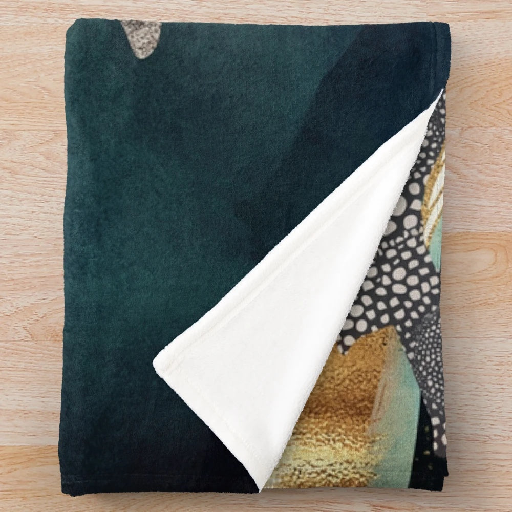 Soft and cozy plush blanket with a whale and ocean-inspired design
