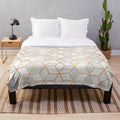 White plush blanket with abstract geometric pattern