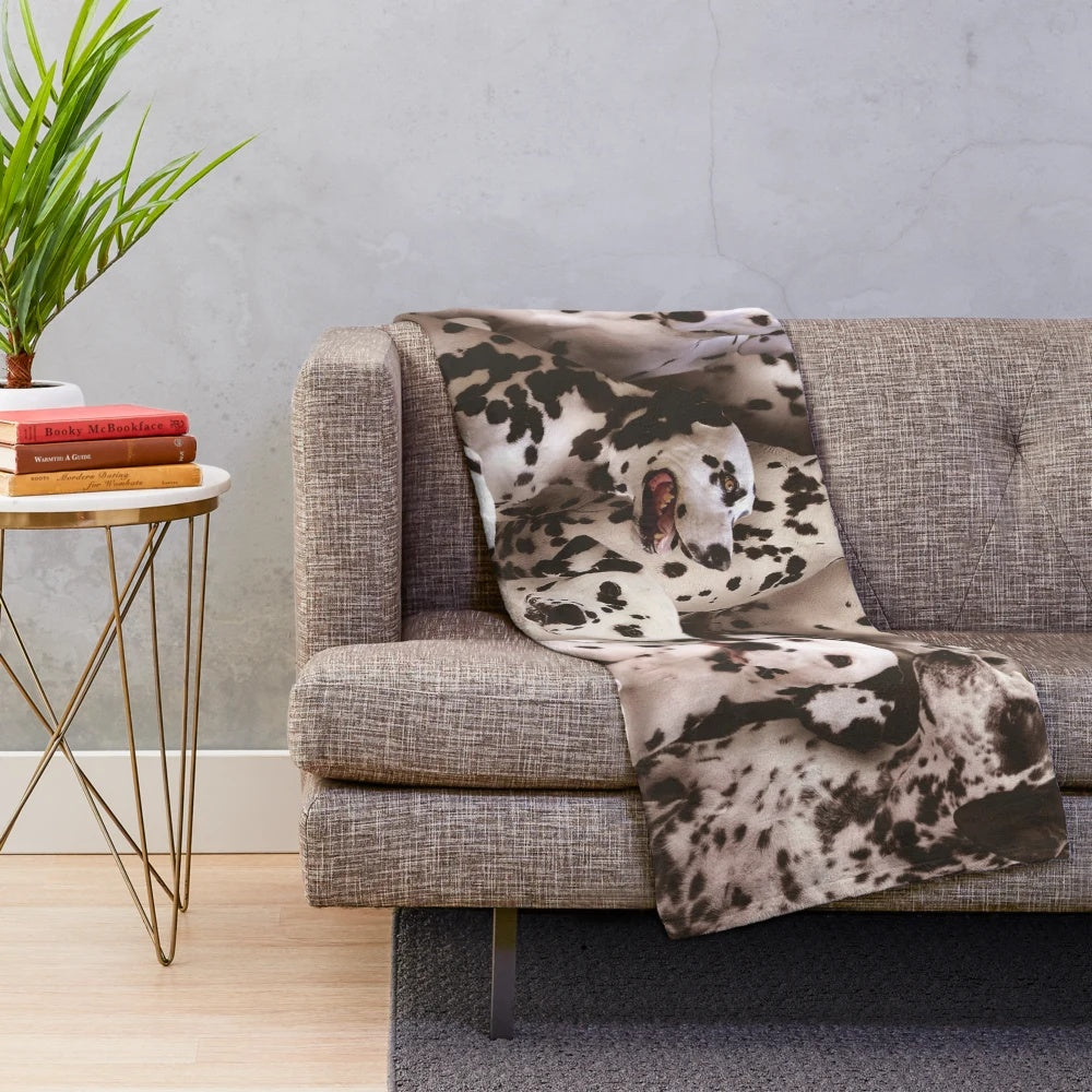 Dalmatian-inspired plush blanket with black and white spotted dog design