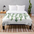 Soft, plush eucalyptus garland patterned blanket