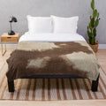 Faux brown cowhide plush blanket
