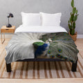 Soft and cozy plush blanket with a beautiful blue and white peacock feather print design