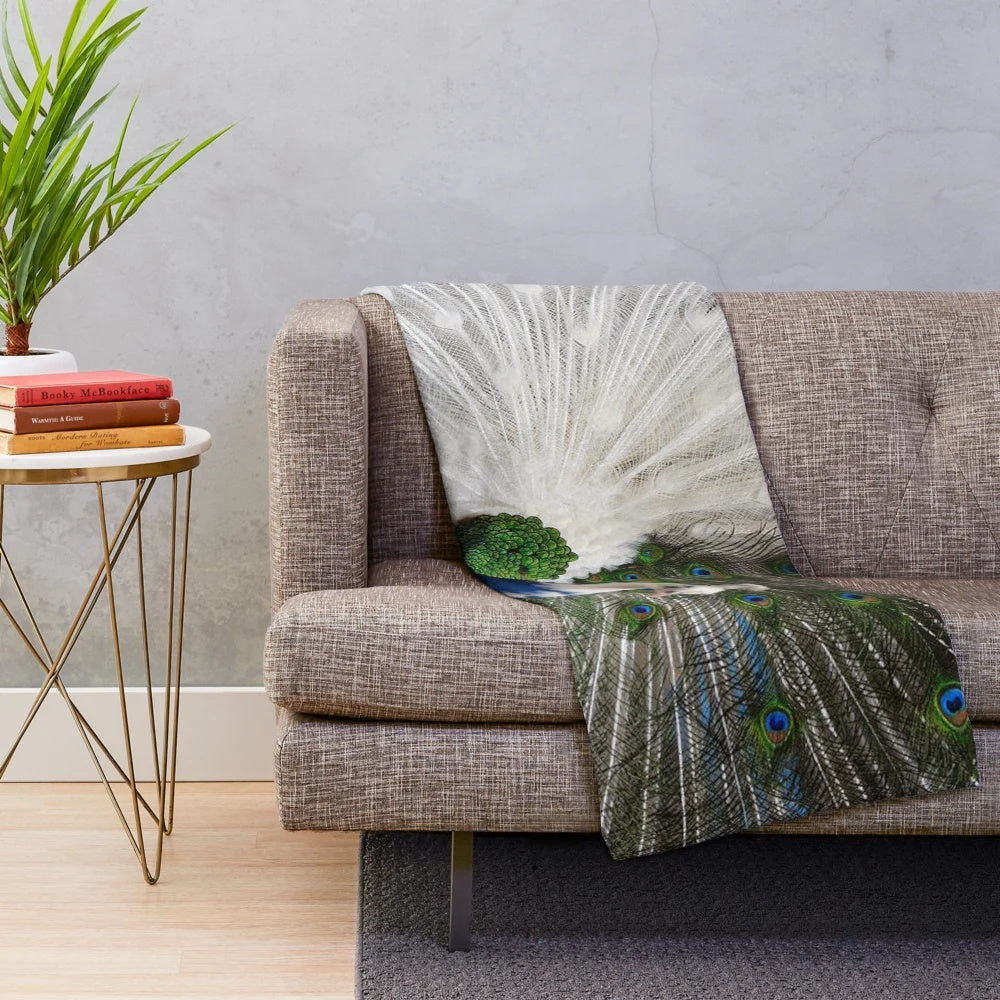 Soft and cozy plush blanket with a beautiful blue and white peacock feather print design