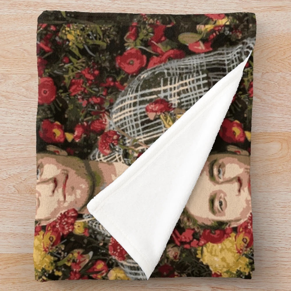 Soft and cozy floral plush blanket featuring Robert Pattinson design