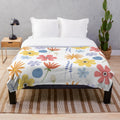Soft and cozy plush blanket with a vibrant floral print design