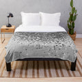 Soft gray plush blanket with shimmery glitter accents