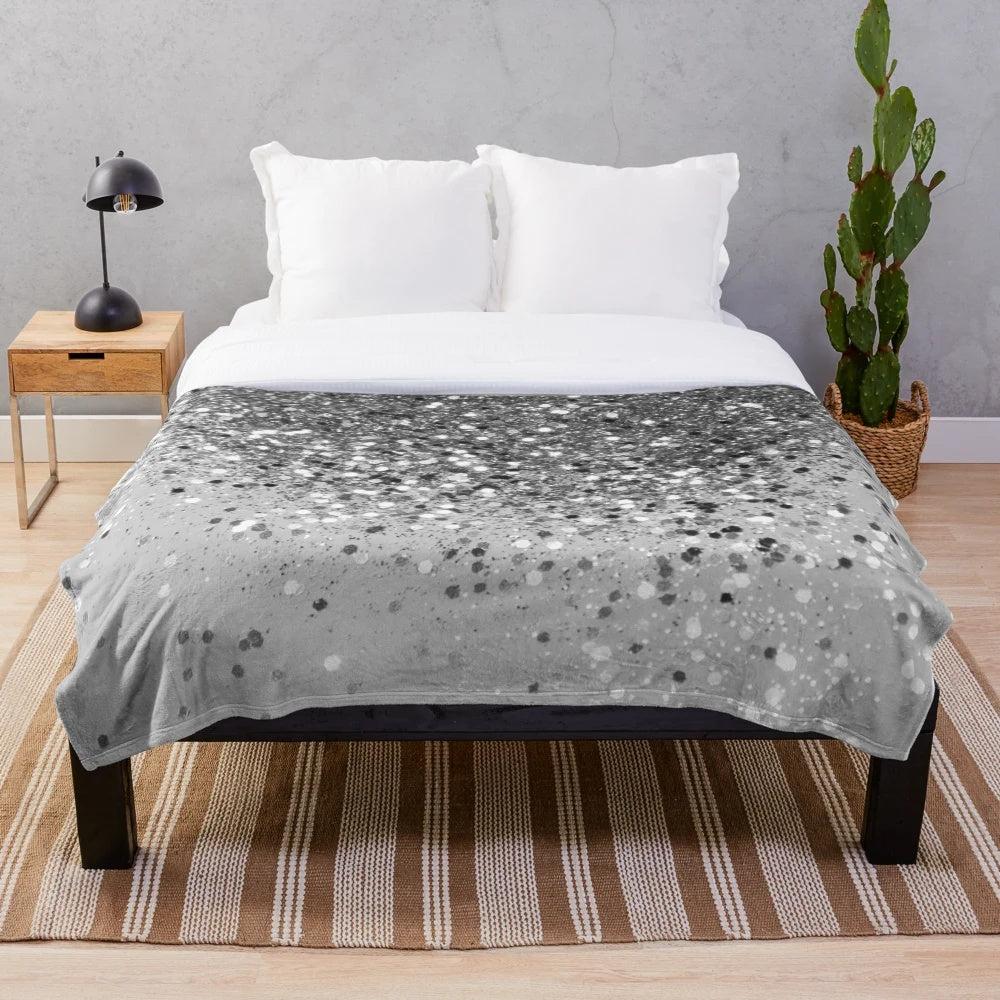 Soft gray plush blanket with shimmery glitter accents