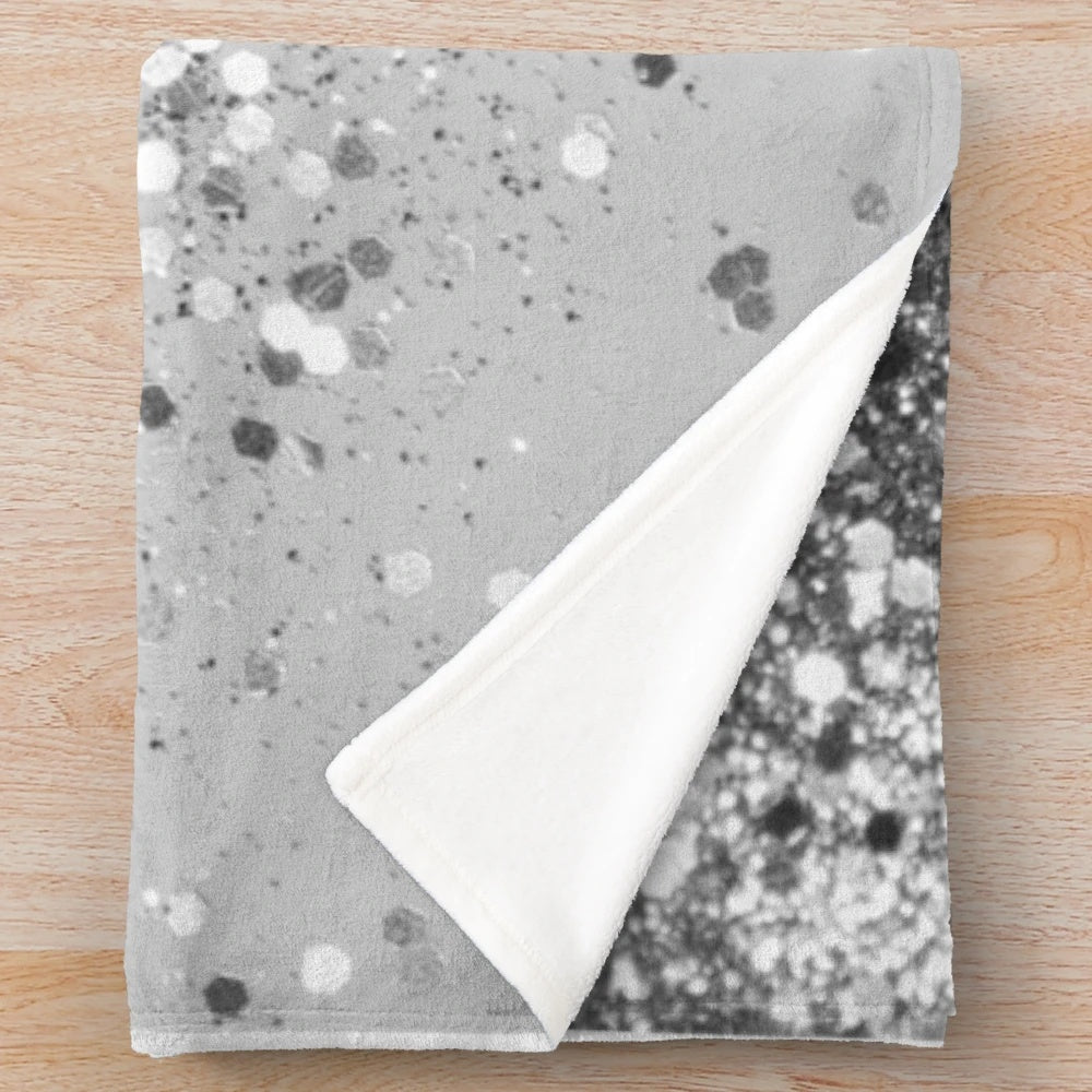 Soft gray plush blanket with shimmery glitter accents