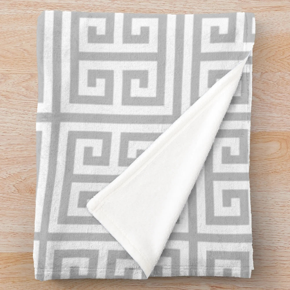 Soft gray plush blanket with a stylish geometric pattern