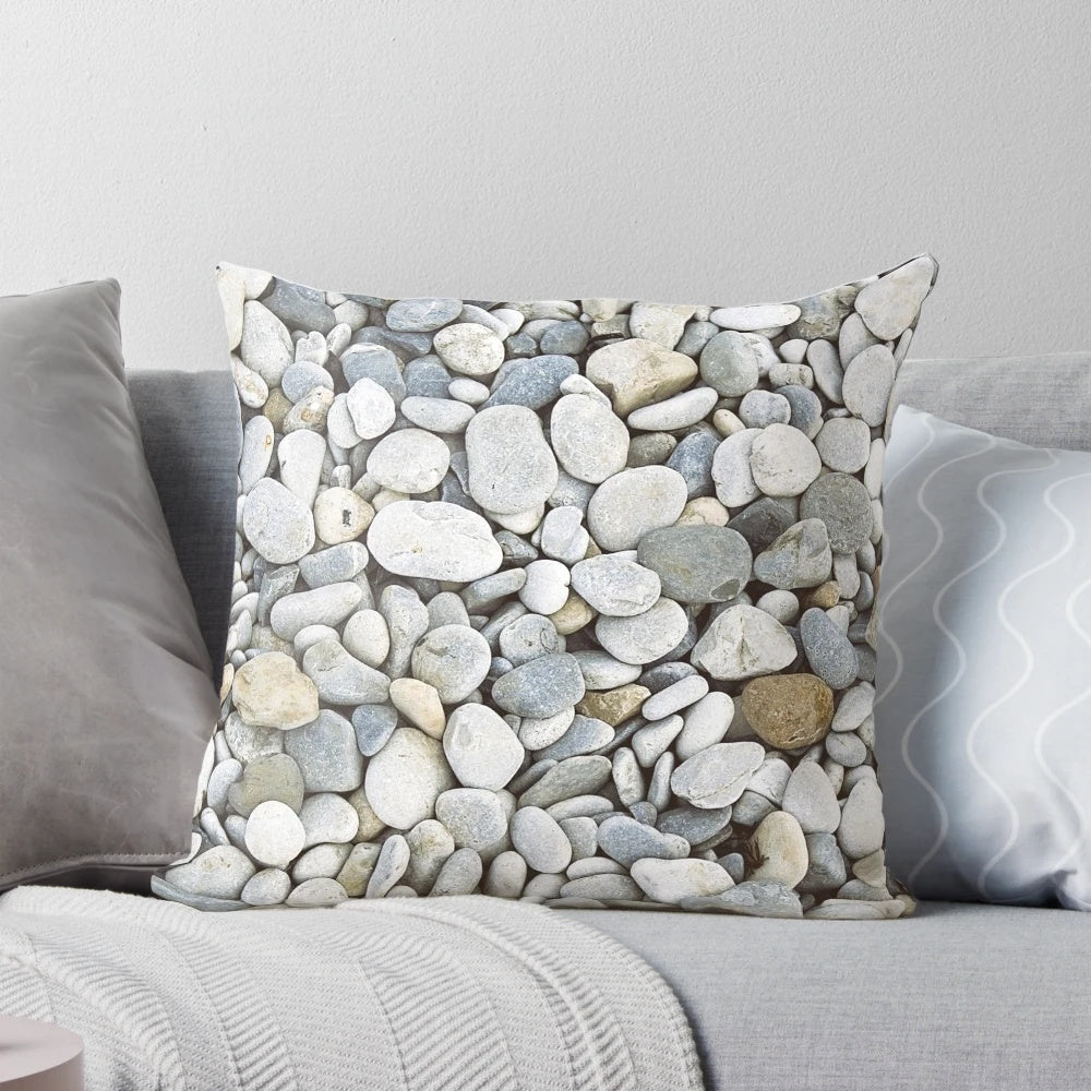 Grey pebbles decorative pillow with a natural, bumpy texture