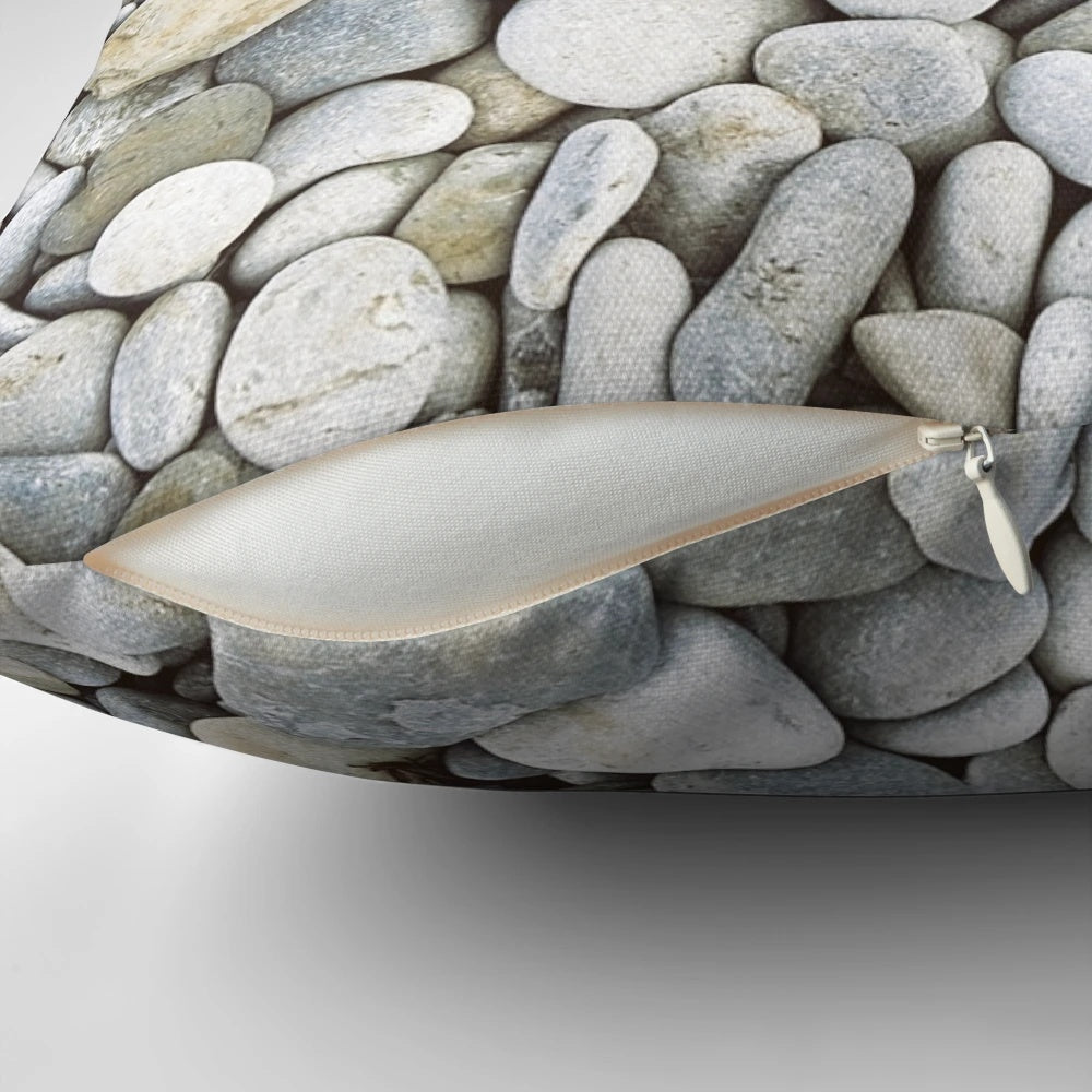 Grey pebbles decorative pillow with a natural, bumpy texture