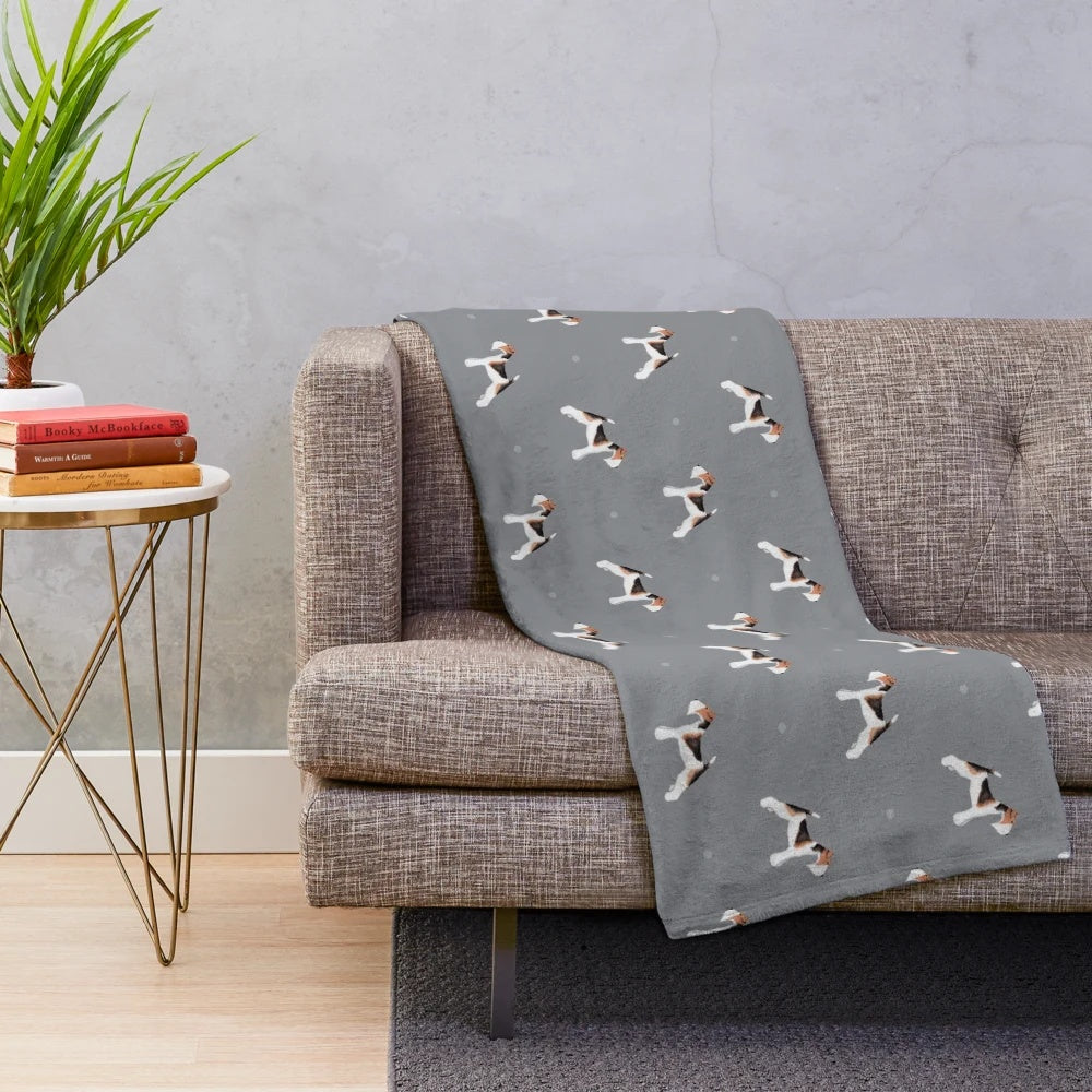 Soft grey plush blanket with a side facing wire fox terrier repeat pattern