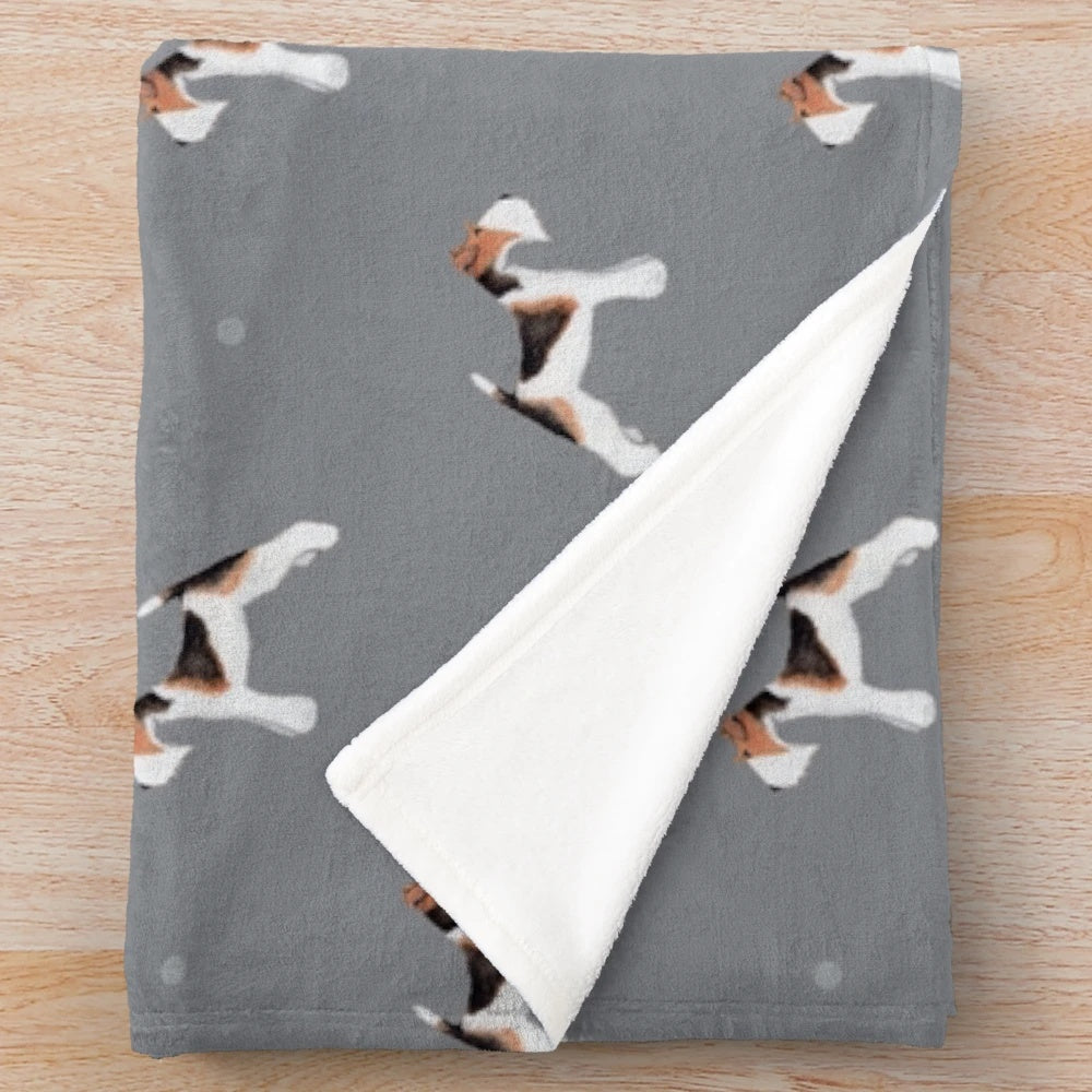 Soft grey plush blanket with a side facing wire fox terrier repeat pattern