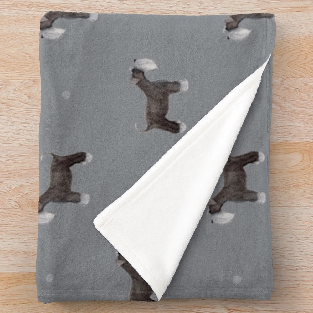 Soft grey plush blanket with a side-facing schnauzer repeat pattern