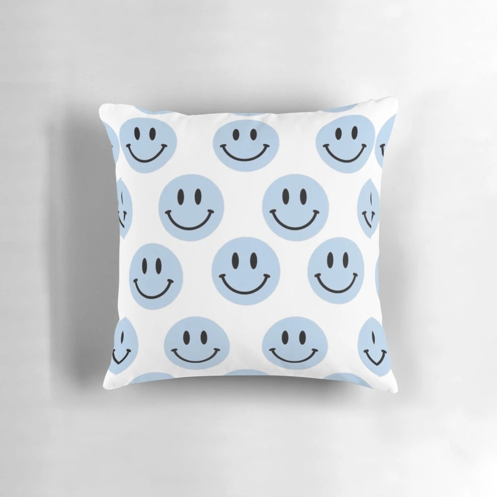 Light blue pillow with a smile design, perfect for adding a cheerful touch to any room.