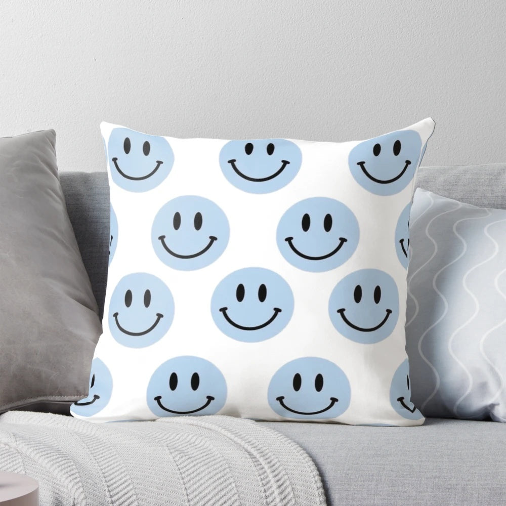 Light blue pillow with a smile design, perfect for adding a cheerful touch to any room.