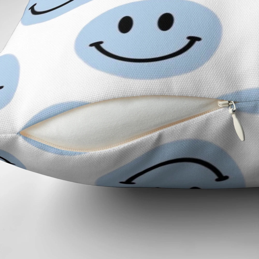 Light blue pillow with a smile design, perfect for adding a cheerful touch to any room.