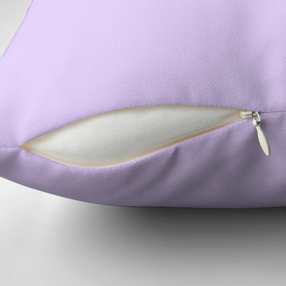 Pale lilac solid color pillow with a soft, plush texture for comfortable home decor.