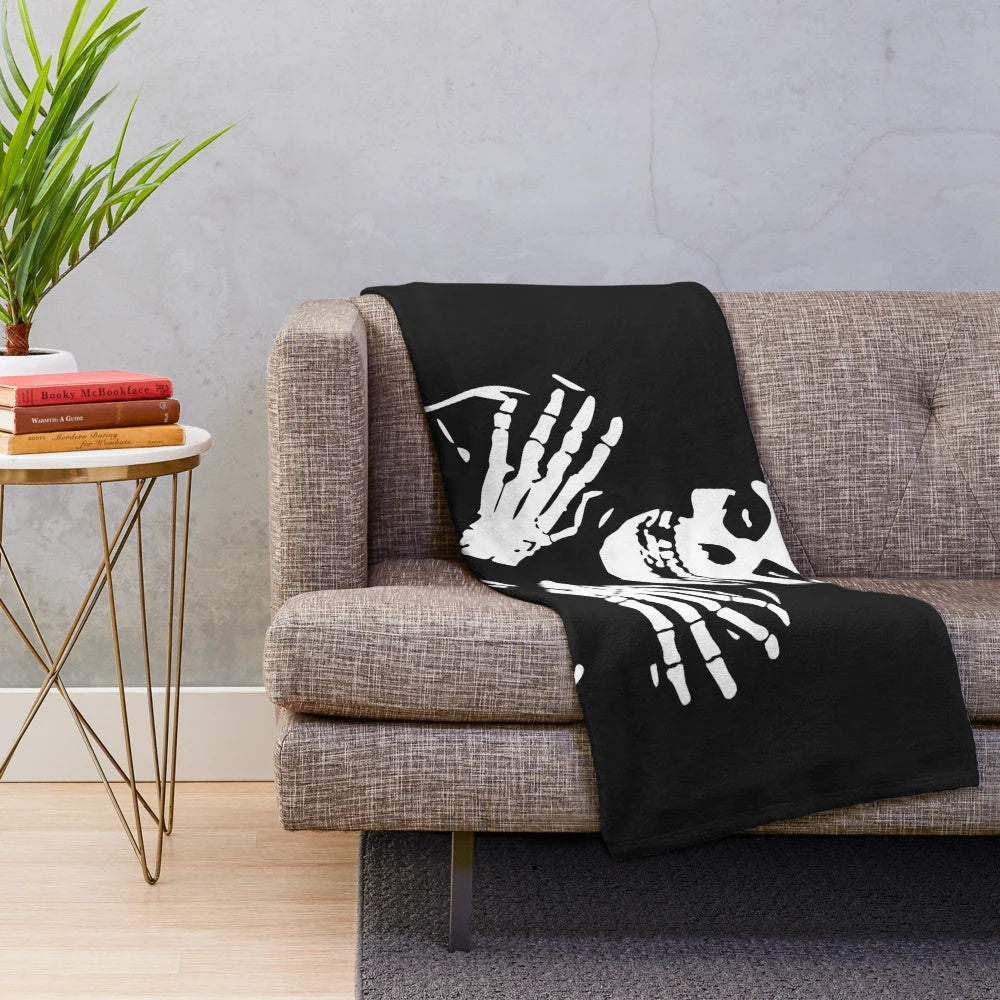 Misfits-inspired plush blanket with skull and band logo design