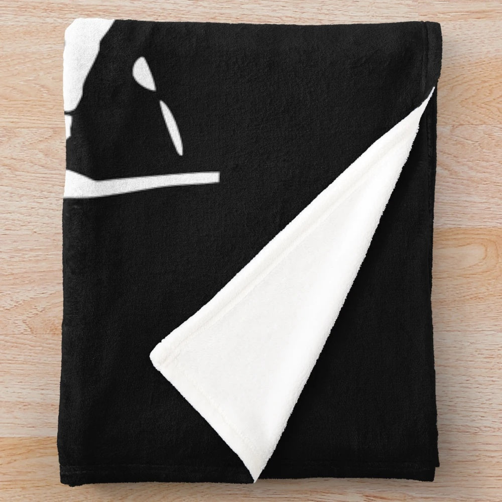 Misfits-inspired plush blanket with skull and band logo design