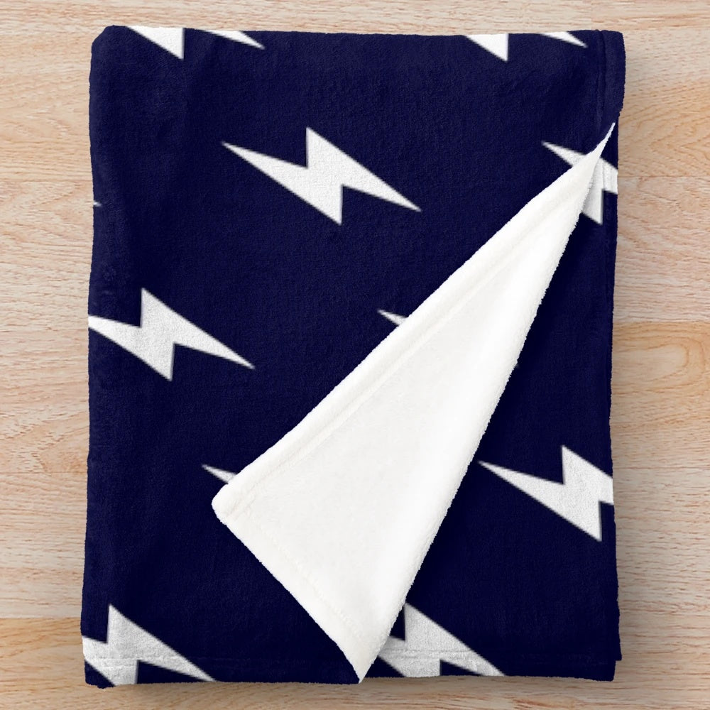 Navy blue plush blanket with white lightning bolt pattern