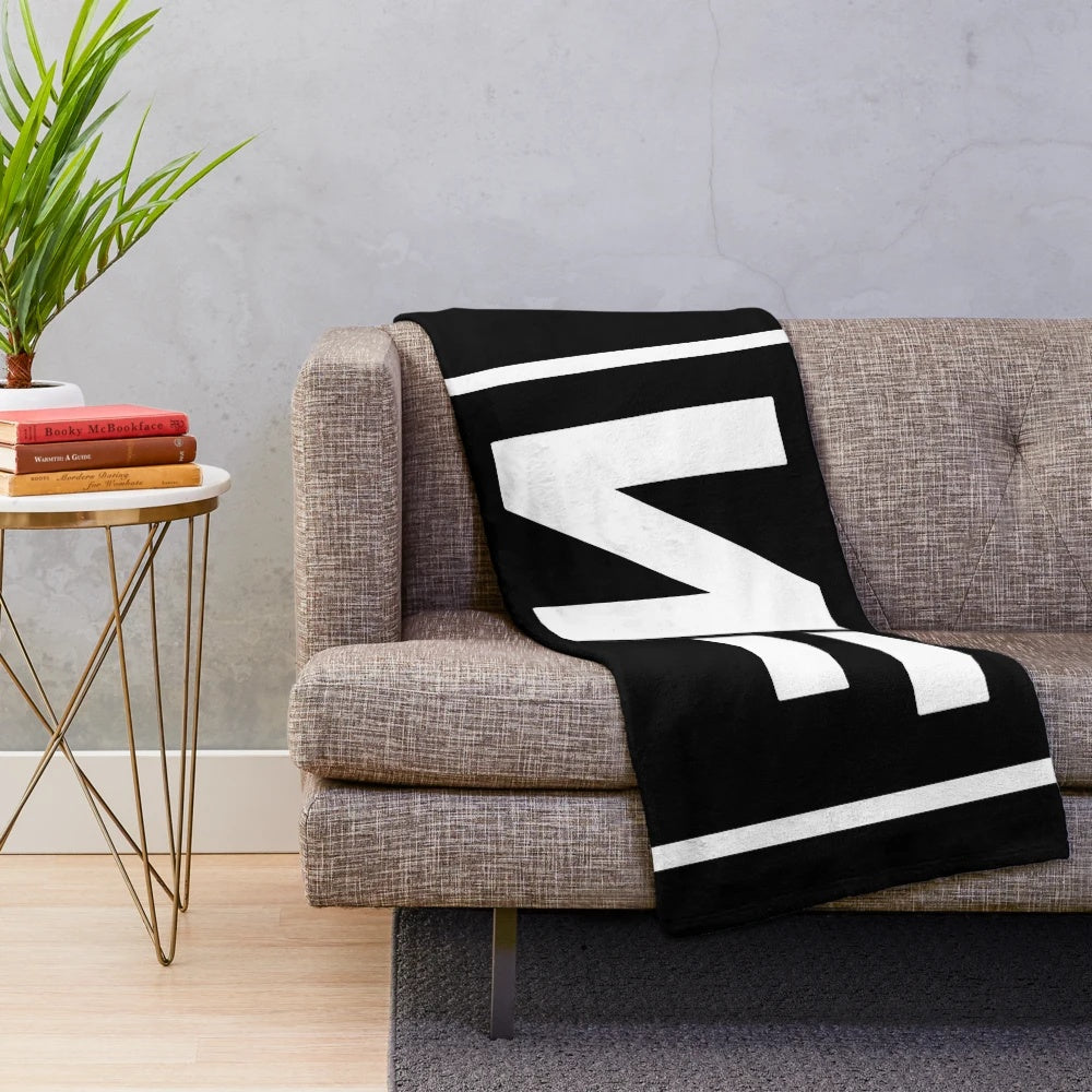Soft and cozy NF logo plush blanket