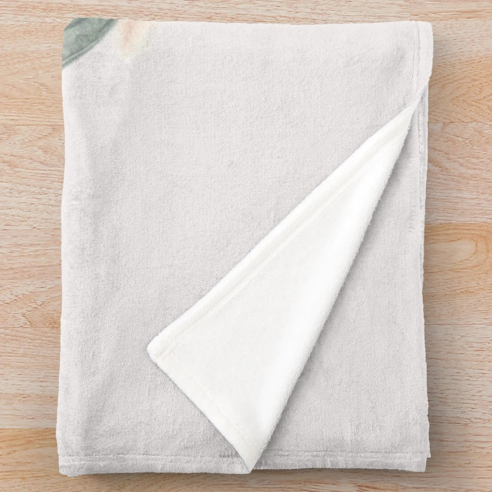 Soft pastel pumpkin plush blanket with a bow