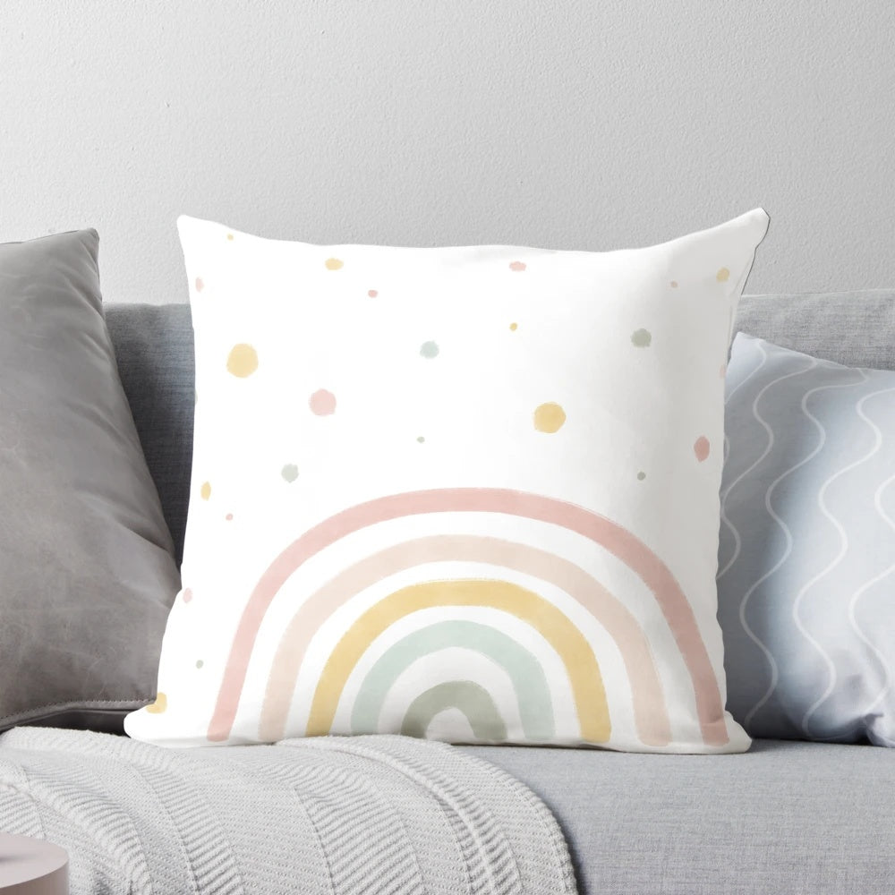 Soft, pastel-colored rainbow pillow for infants and babies