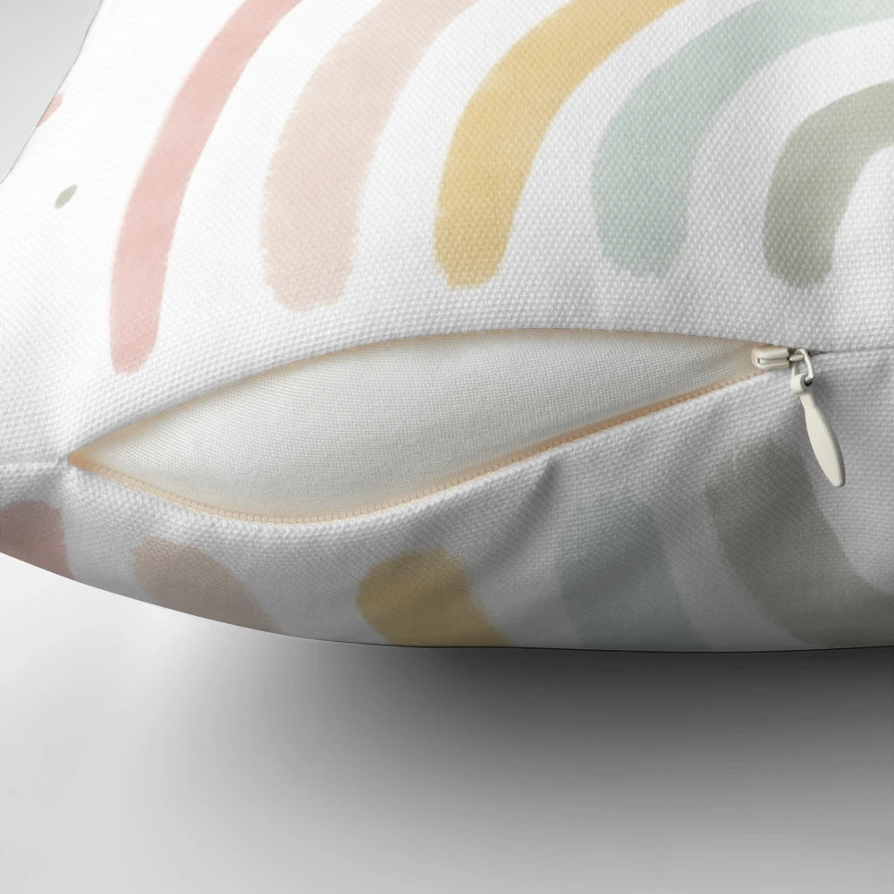 Soft, pastel-colored rainbow pillow for infants and babies