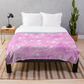 Soft pink plush blanket with a 90s heart backdrop design