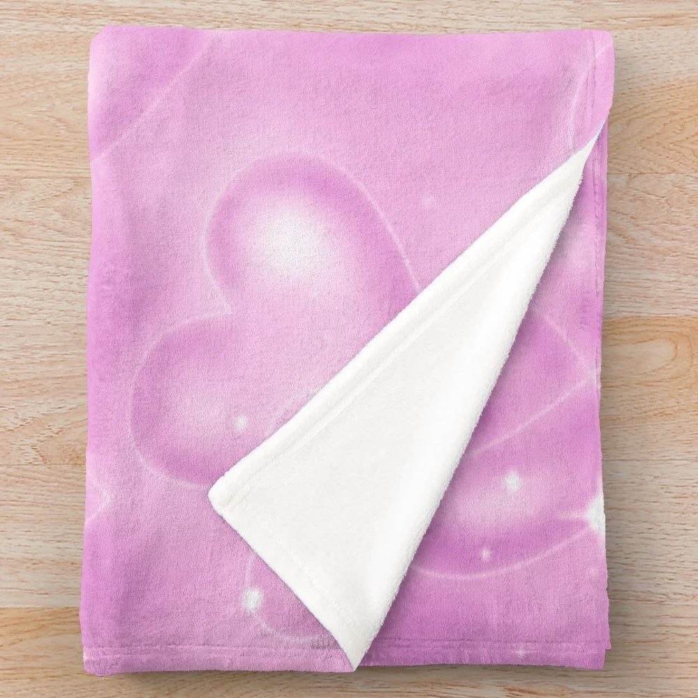 Soft pink plush blanket with a 90s heart backdrop design