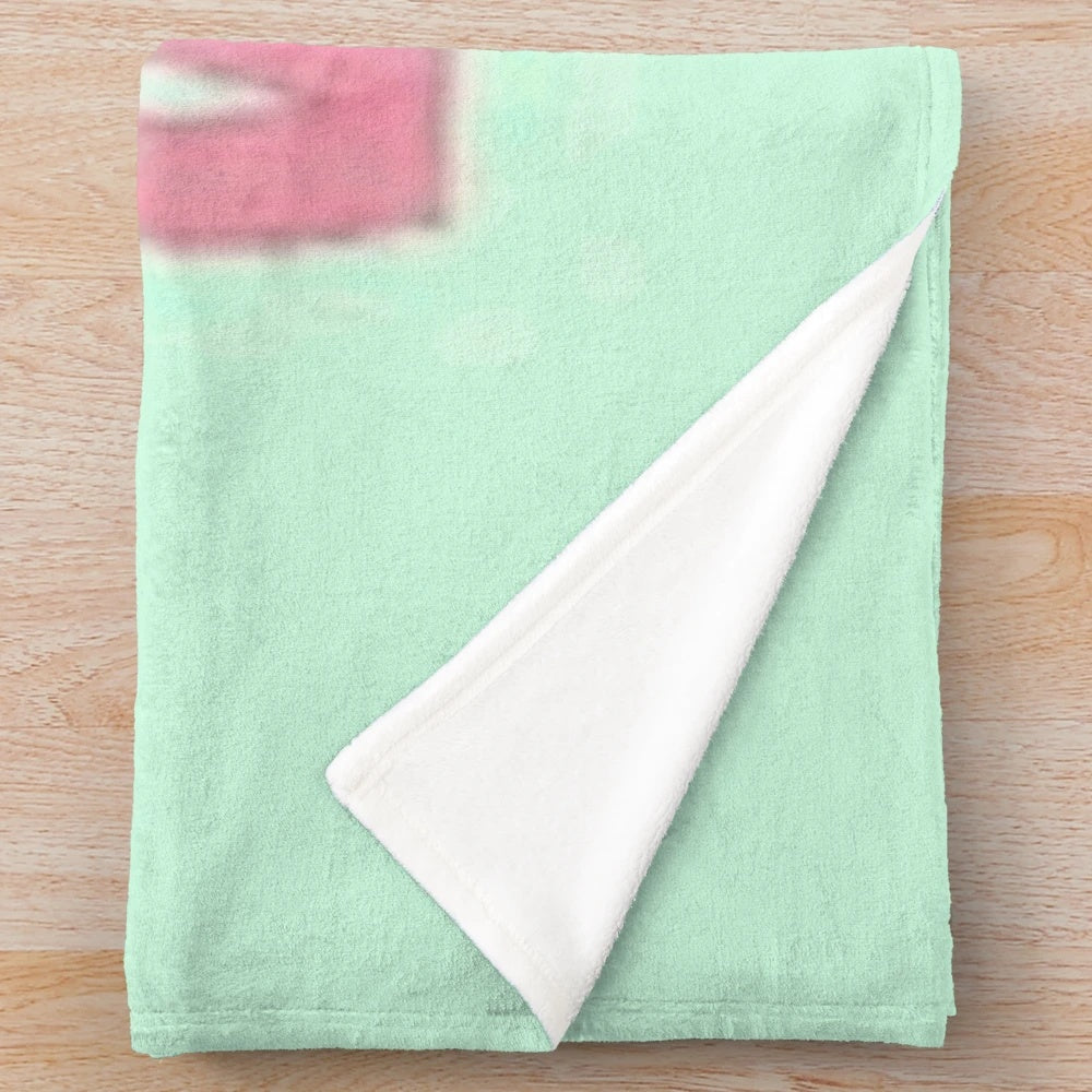 Soft pink plush blanket featuring a cartoon character design