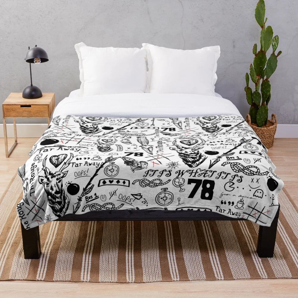 Plush blanket with tattoo-inspired one direction and 5 seconds of summer designs