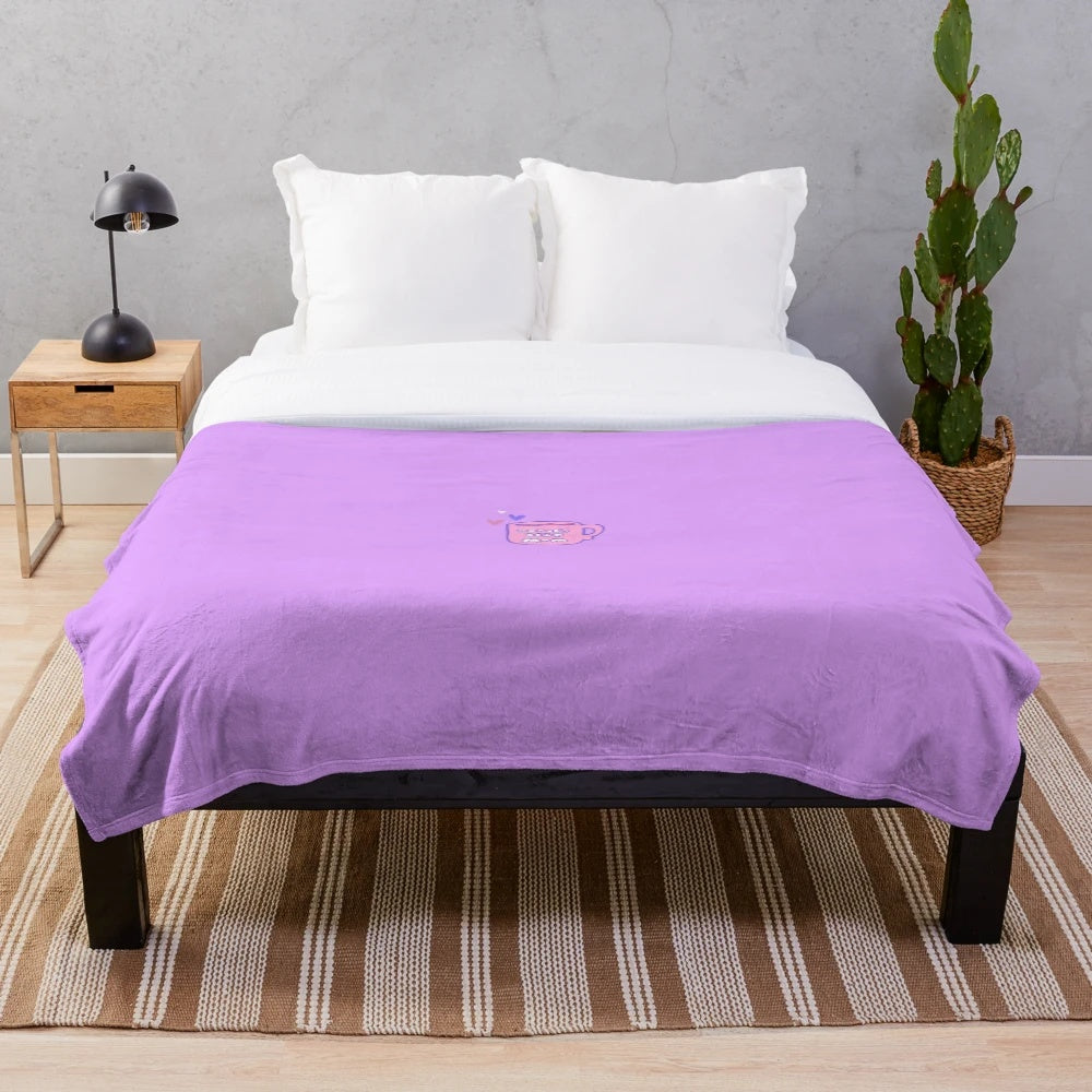 Soft pink plush blanket with "World's Best Mom" text and coffee mug motif