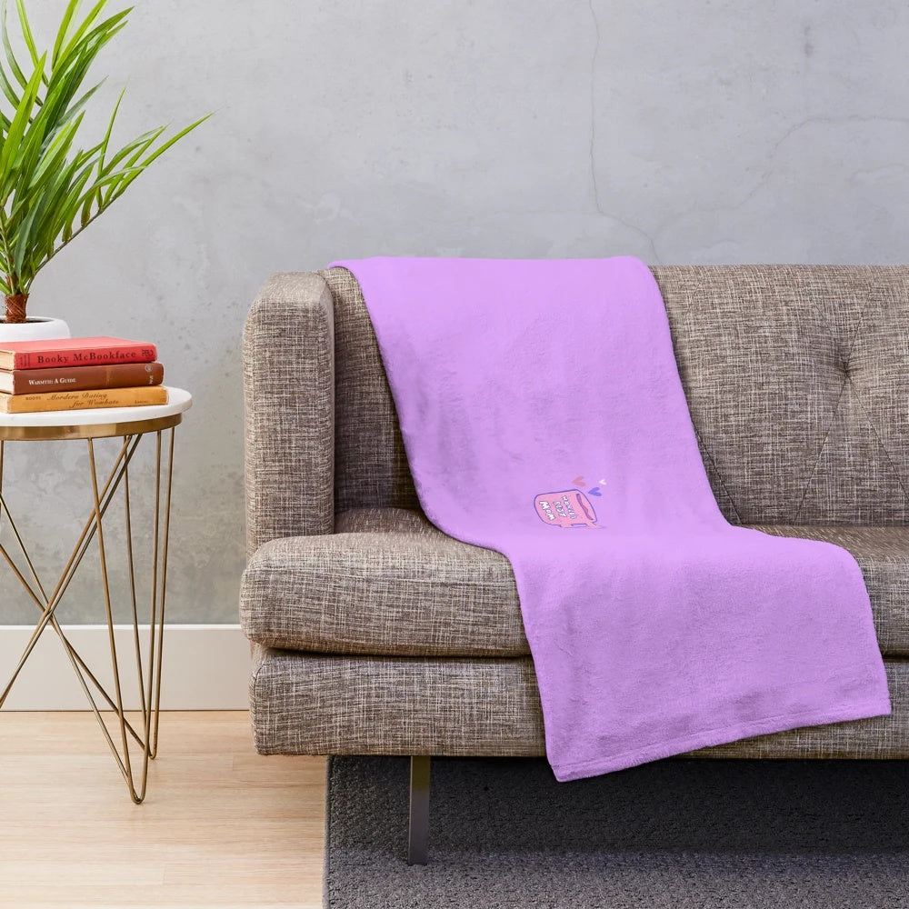 Soft pink plush blanket with "World's Best Mom" text and coffee mug motif