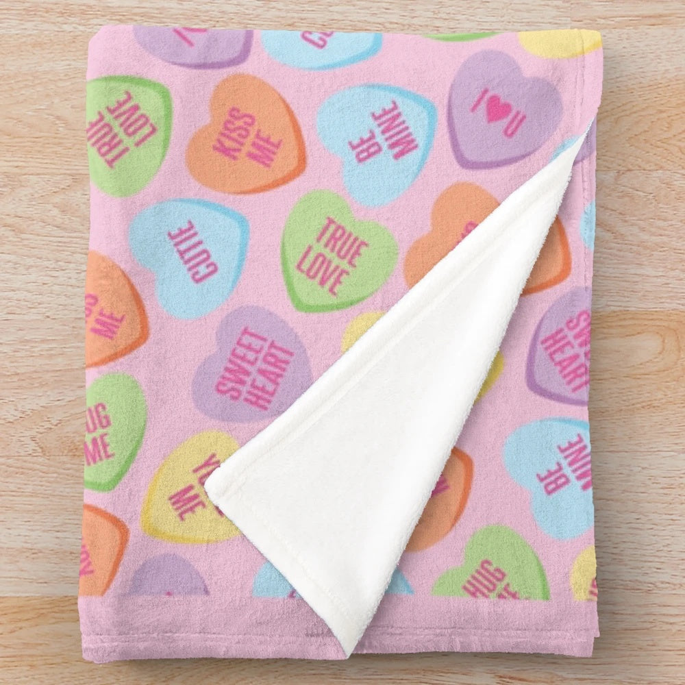 Soft plush blanket with pastel conversation hearts design